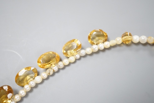 A single strand oval cut citrine and seed pearl set fringe necklace, with 9ct clasp, 44cm